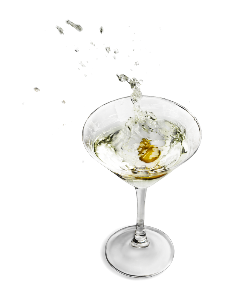 Green Olive Splashing in a Cocktail Glass